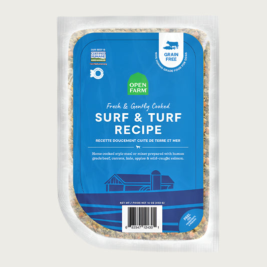 A 16 oz clear pouch of Open Farm Fresh & Gently Cooked Surf & Turf Recipe. Blue label covers the front, with product details: Grain Free, 100% Human Grade Food for Dogs, Animal Welfare Certified. Peel corner to open pouch.