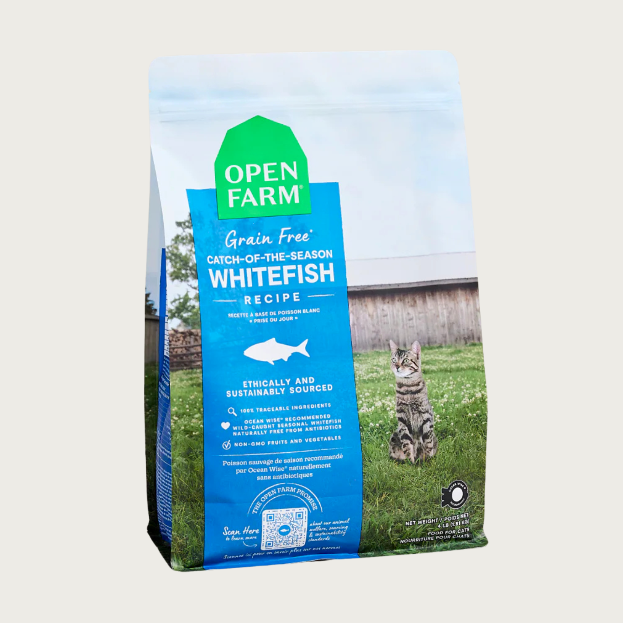 A 4 lb bag of Open Farm Grain Free Whitefish Recipe cat food. Humanely and sustainably sourced. A photo of a tabby cat standing in a field on a farm covers the bag, with a blue bar behind the white text to highlight it.