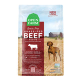 A bag of Open Farm Grain Free Beef Recipe dog food. Humanely raised and sustainably sourced. A photo of a Vizsla dog standing in a field on a farm covers the bag, with a red bar behind the white text to highlight it.