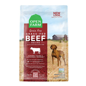 A bag of Open Farm Grain Free Beef Recipe dog food. Humanely raised and sustainably sourced. A photo of a Vizsla dog standing in a field on a farm covers the bag, with a red bar behind the white text to highlight it.