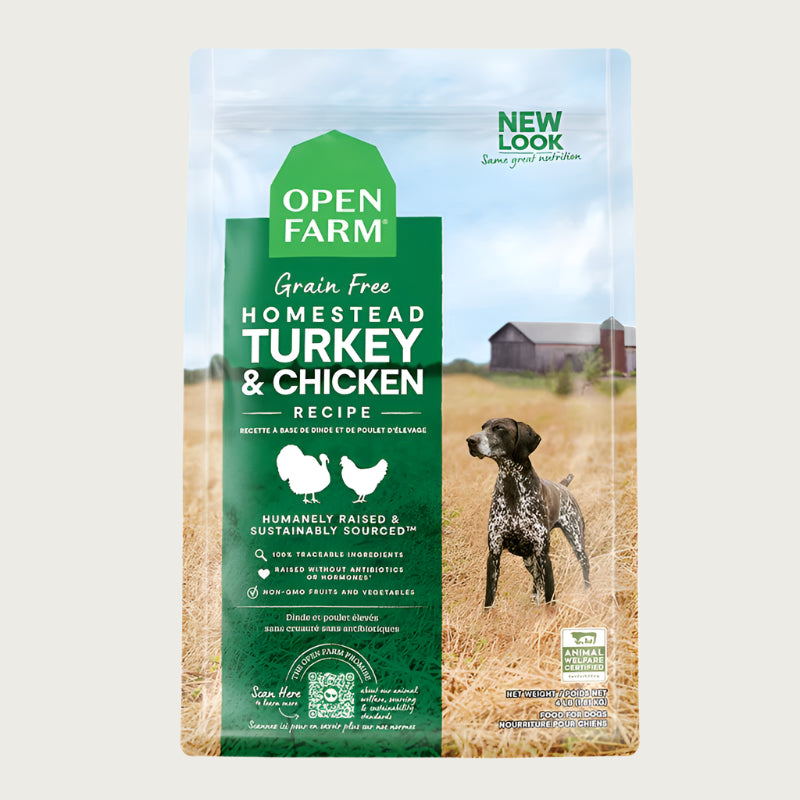 A bag of Open Farm Grain Free Turkey & Chicken Recipe dog food. Humanely raised and sustainably sourced. A photo of a Pointer dog standing in a field on a farm covers the bag, with a green bar behind the white text to highlight it.