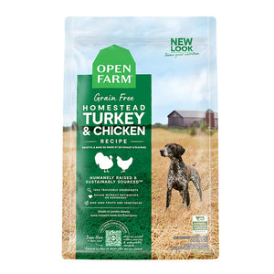 A bag of Open Farm Grain Free Turkey & Chicken Recipe dog food. Humanely raised and sustainably sourced. A photo of a Pointer dog standing in a field on a farm covers the bag, with a green bar behind the white text to highlight it.