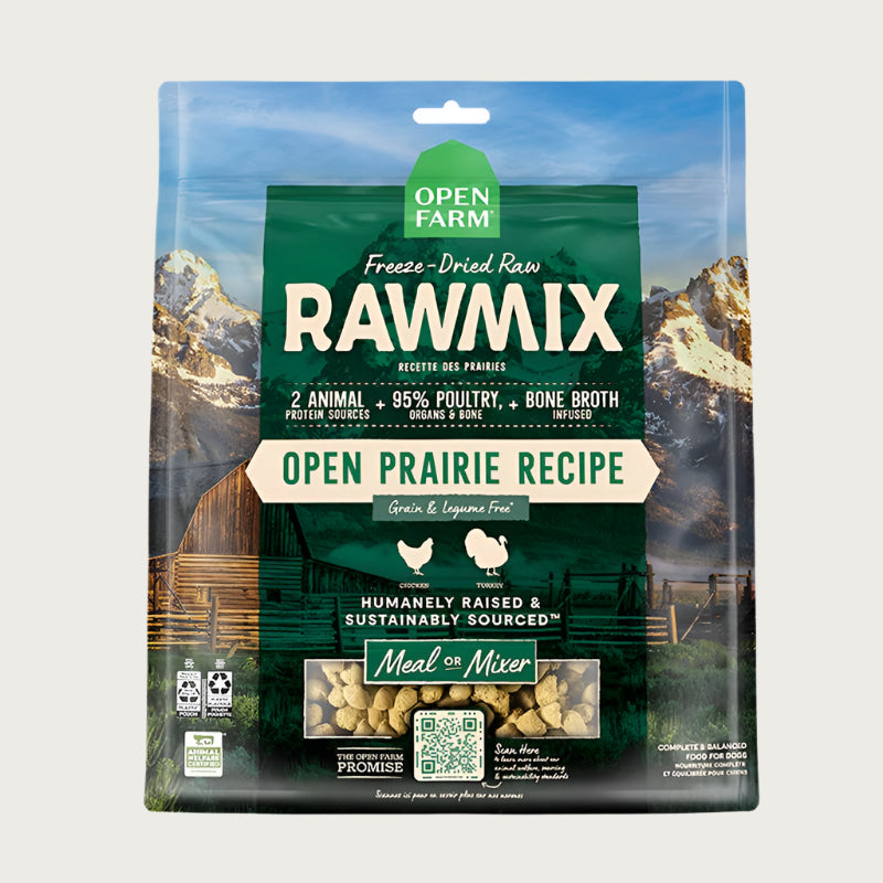 A 13.5 oz bag of Open Farm RawMix Freeze-Dried Raw Open Prairie Recipe dog food. 2 animal protein sources, 95% poultry, organs & bone, bone broth infused. Humanely raised and sustainably sourced. A mountain ranch scene is in the background of the bag, with a vertical green bar behind the white text to highlight it.