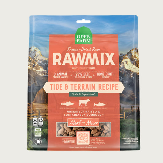 A 13.5 oz bag of Open Farm RawMix Freeze-Dried Raw Tide & Terrain Recipe dog food. 3 animal protein sources, 95% beef, fish, organs & bone, bone broth infused. Humanely raised and sustainably sourced. A mountain ranch scene is in the background of the bag, with a vertical orange bar behind the white text to highlight it.