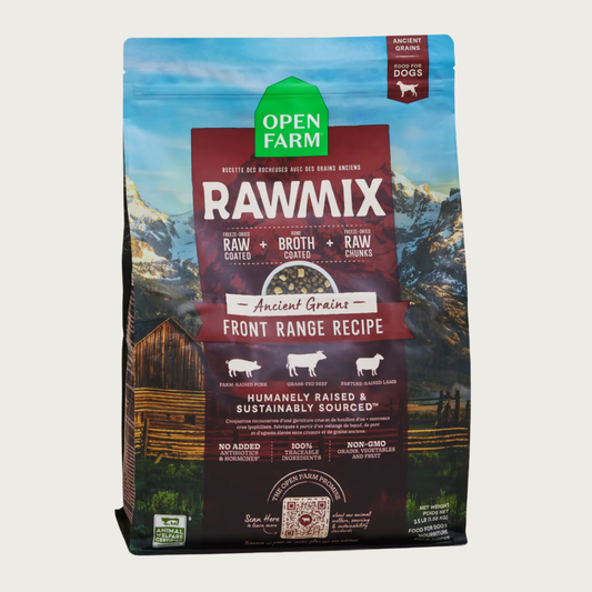 A bag of Open Farm RawMix Ancient Grains Front Range Recipe dog food. Humanely raised and sustainably sourced. A mountain ranch scene is in the background of the bag, with a vertical red bar behind the white text to highlight it.
