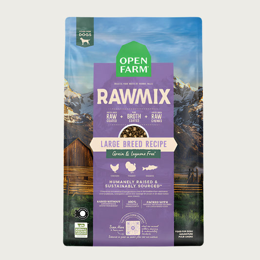 A bag of Open Farm RawMix Grain Free Large Breed Recipe dog food. Humanely raised and sustainably sourced. A mountain ranch scene is in the background of the bag, with a vertical lilac bar behind the white text to highlight it.