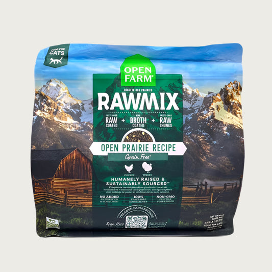 A 2.25 lb bag of Open Farm RawMix Grain Free Open Prairie Recipe cat food. Humanely raised and sustainably sourced. A mountain ranch scene is in the background of the bag, with a vertical green bar behind the white text to highlight it.