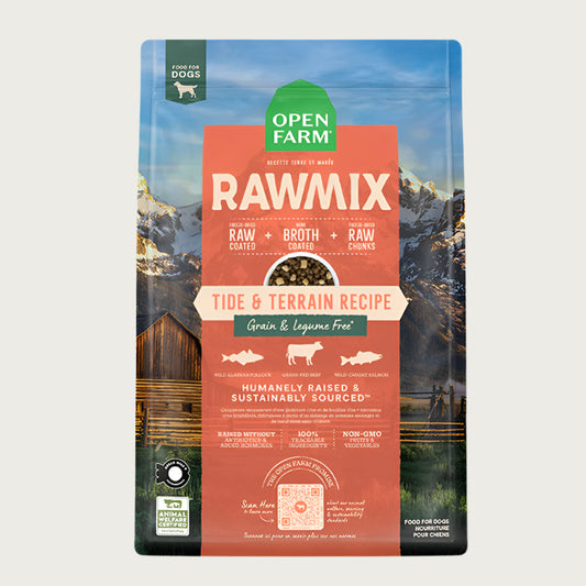 A bag of Open Farm RawMix Grain Free Tide & Terrain Recipe dog food. Humanely raised and sustainably sourced. A mountain ranch scene is in the background of the bag, with a vertical orange bar behind the white text to highlight it.