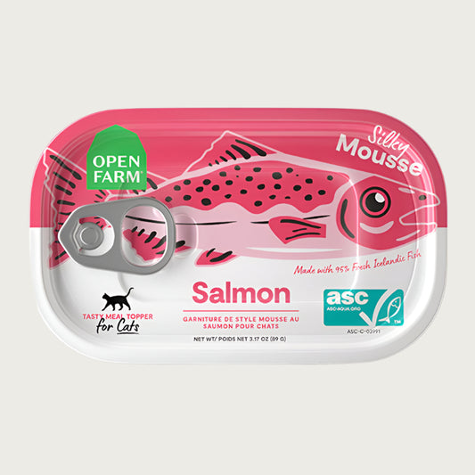 An oblong shaped can with pull top, of Open Farm Silky Mousse Salmon Meal Topper for Cats, Net Wt 3.17 oz. Pink illustration of a salmon is on top.
