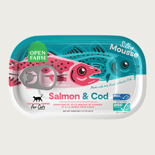 An oblong shaped can with pull top, of Open Farm Silky Mousse Salmon & Cod Meal Topper for Cats, Net Wt 3.17 oz. Pink and blue illustration of a salmon and a cod fish is on top.