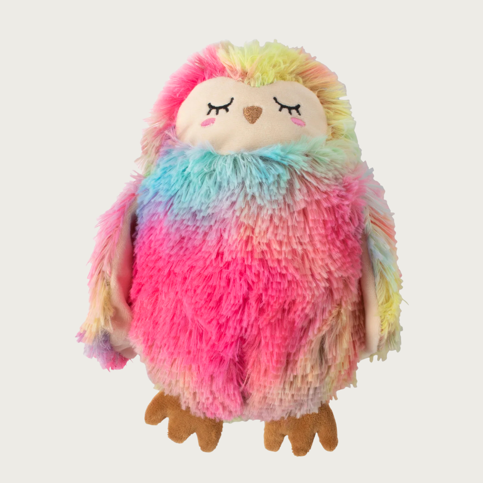 Plush owl dog toy covered in brightly colored faux fur. It has embroidered facial details and brown feet.