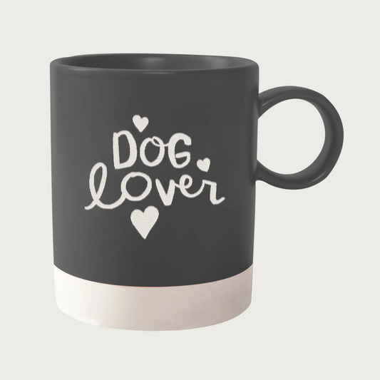 Charcoal gray mug with cream colored base. Text in center reads 'Dog Lover' in cream script font with 3 cream hearts around text. 