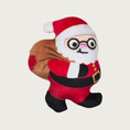 Load image into Gallery viewer, Plush Santa Claus dog toy wearing glasses, smiling and carrying a toy sack over his shoulder.
