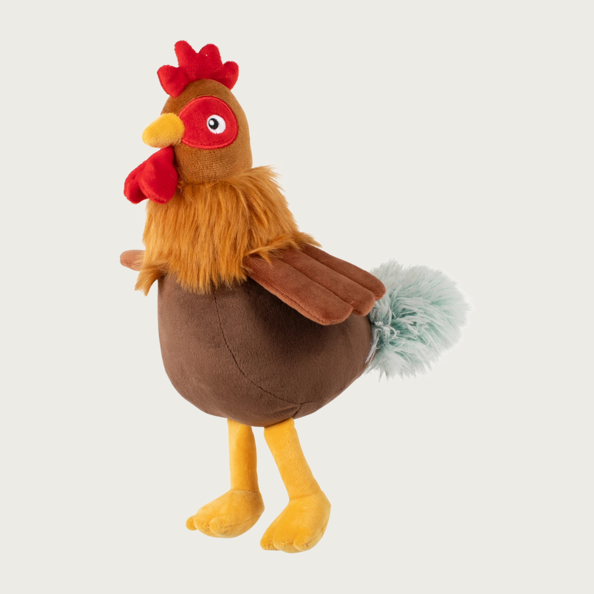 Plush rooster dog toy with a red comb and waddle, yellow beak & legs, and fuzzy faux fur "feathers" around its neck and tail.