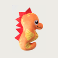 Load image into Gallery viewer, A plush seahorse dog toy in orange with yellow fin & belly accents, a red spiky back, and large embroidered eyes & smile.
