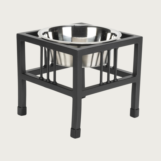Black metal, elevated pet feeder with a stainless steel bowl.