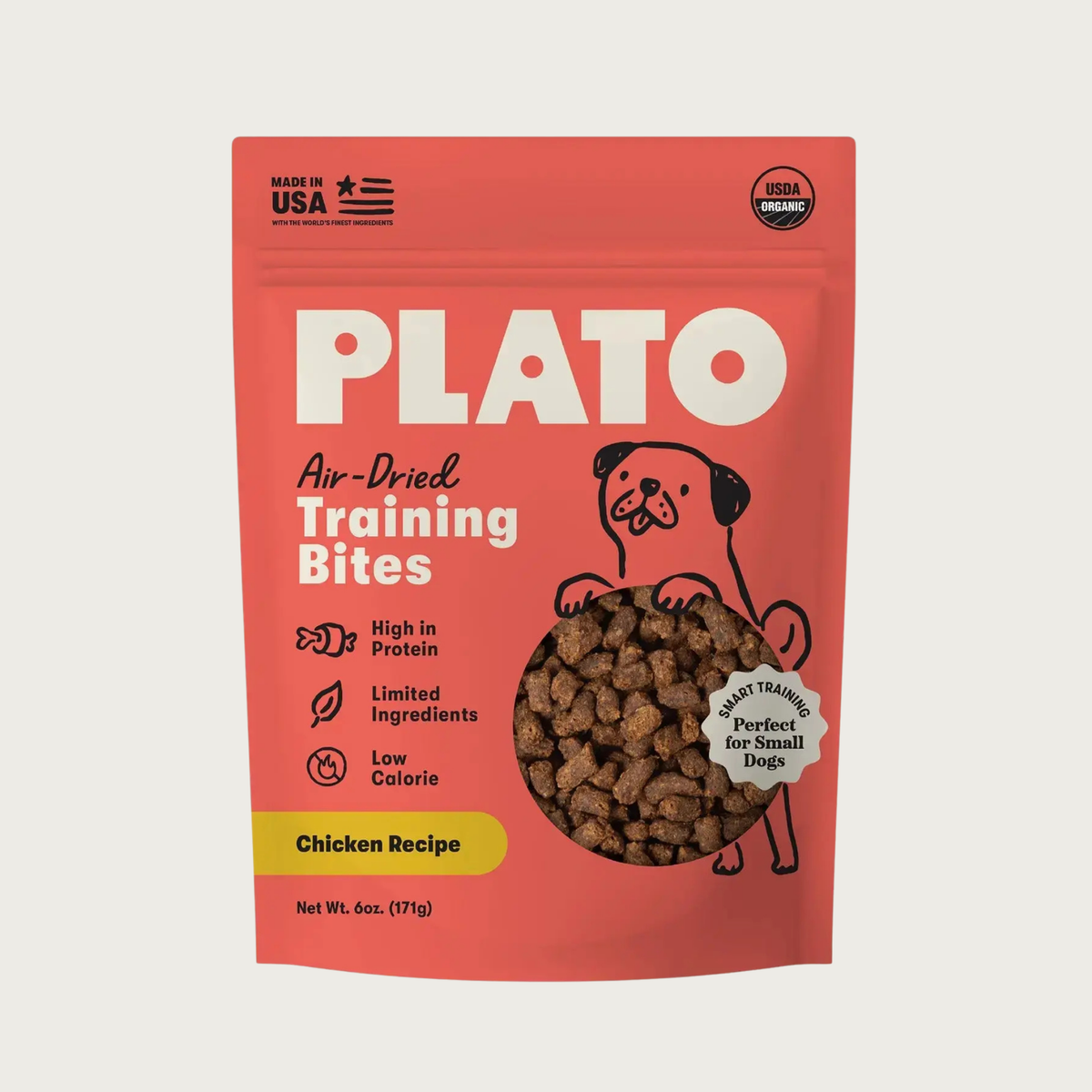 A 6 oz pouch of Plato Air-Dried Training Bites Chicken Recipe dog treats. The packaging is a vibrant coral-red color with bold white text, a simple black line illustration of a dog, and a clear window showing the small, rectangular shaped brown treats inside. USDA Organic, Made in USA, Perfect for Small Dogs.