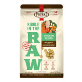 A 9 pound bag of chicken recipe Kibble in the Raw dog food from Primal Pet Foods. Text on bag reads "Kibble sized bites made with freeze-dried raw chicken" and "Serve like kibble. Nourish like raw." There is an image of fresh produce with a raw chicken breast, and a smaller image of the bite-sized morsels that are in the bag.