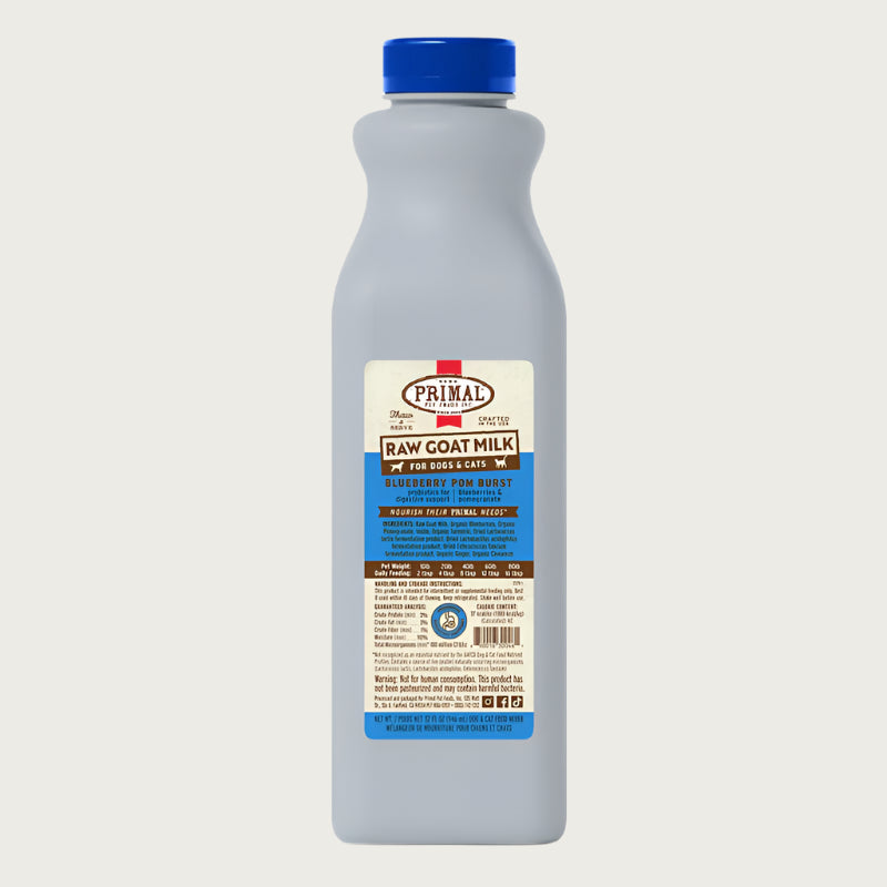 A 32 ounce plastic bottle of frozen Primal raw goat milk blueberry pomegranate recipe for dogs and cats of all life stages, with probiotics for digestive support.