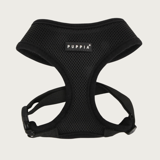 Soft mesh, black dog harness with black & white 'Puppia' brand tag on chest.