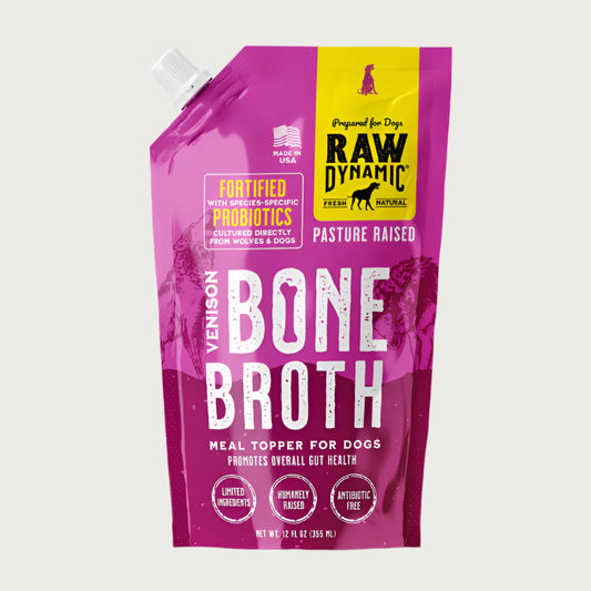 Raw Dynamic Venison Bone Broth for dogs in a 12 oz fuchsia pouch, featuring pasture raised venison. Fortified with species-specific probiotics to promote overall gut health. Treat or meal topper for dogs.
