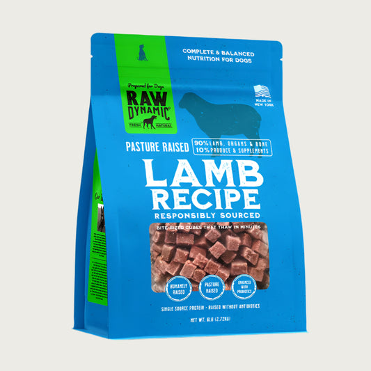 Raw Dynamic Frozen Raw Lamb dog food in a light blue bag, made from pasture raised lamb, grain-free, all-natural, and rich in protein for healthy dogs. Packaged in a six pound bag.