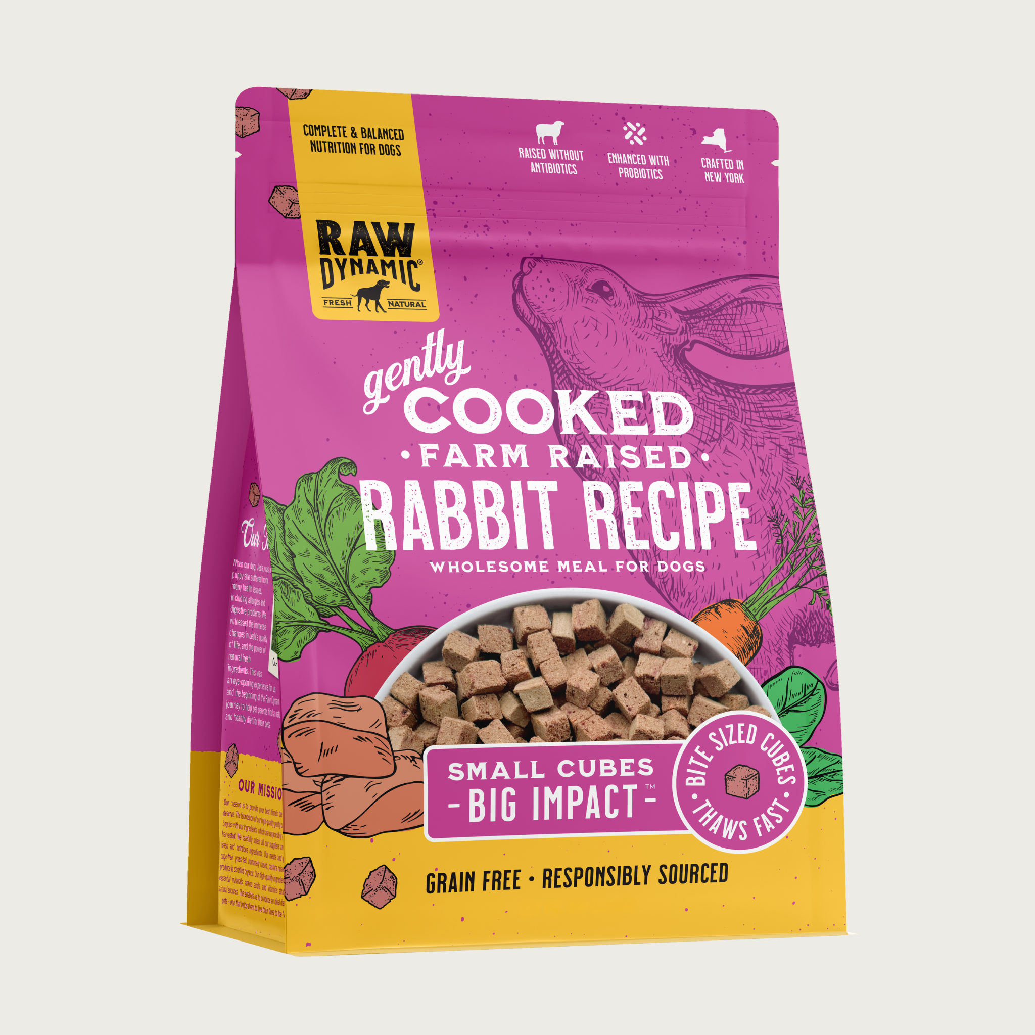 Raw Dynamic Gently Cooked Farm Raised Rabbit Recipe wholesome meal for dogs, packaged in a hot pink bag with illustrations of a rabbit and vegetables. Additional text reads: small cubes, big impact. Bite sized cubes thaws fast. Complete & balanced nutrition for dogs. Grain free, responsibly sourced. Half-moon shaped transparent window on bottom 1/3 of bag shows small, tan cubes of food.
