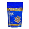 12 oz blue bag of all natural lamb jerky dog & puppy treats from The Real Meat Company. 95% lamb, no fillers. Small, clear, paw print shaped window on bag shows product inside - brown, rectangular shaped treats.