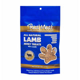 4 oz blue bag of all natural lamb jerky dog & puppy treats from The Real Meat Company. 95% lamb, no fillers. Small, clear, paw print shaped window on bag shows product inside - brown, rectangular shaped treats.