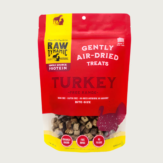 Raw Dynamic Air Dried Turkey treats for dogs and cats in a small red bag, made from free range turkey, grain-free, all-natural, and rich in protein for healthy pets. Bite sized treats.