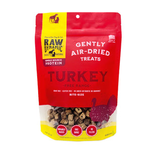Raw Dynamic Air Dried Turkey treats for dogs and cats in a small red bag, made from free range turkey, grain-free, all-natural, and rich in protein for healthy pets. Bite sized treats.