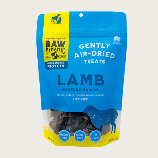 Raw Dynamic Air Dried Lamb treats for dogs and cats in an blue small bag, made from pasture raised lamb, grain-free, all-natural, and rich in protein for healthy pets. Bite sized treats.