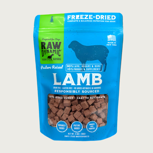Raw Dynamic Raw Lamb freeze-dried dog food in a light blue bag, made from pasture raised lamb, grain-free, all-natural, and rich in protein for healthy dogs.