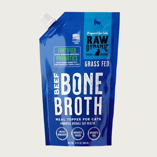 Raw Dynamic Beef Bone Broth for cats in a blue pouch, featuring grass fed beef  ingredients packed with probiotics and nutrients, ideal as a healthy meal topper for cats.