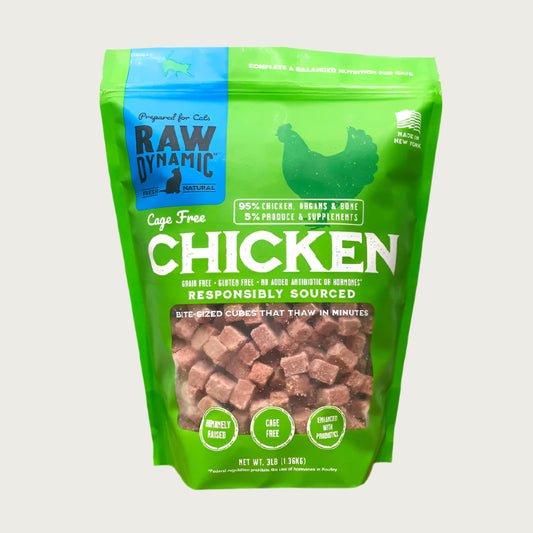 Raw Dynamic Raw Chicken frozen raw cat food in a green bag, made from cage free chicken, grain-free, all-natural, and rich in protein for healthy cats.