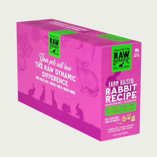 Raw Dynamic Frozen Raw Rabbit dog food in a pink box, made from farm raised rabbit, grain-free, all-natural, and rich in protein for healthy dogs. Packaged in a twelve pound box.
