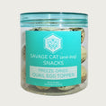 Load image into Gallery viewer, A 2 oz clear plastic container, filled with freeze-dried quail eggs by Savage Cat. Snacks for cats and dogs, about 20 eggs per container. Eggs are very small, and have a tan color with brown speckles.
