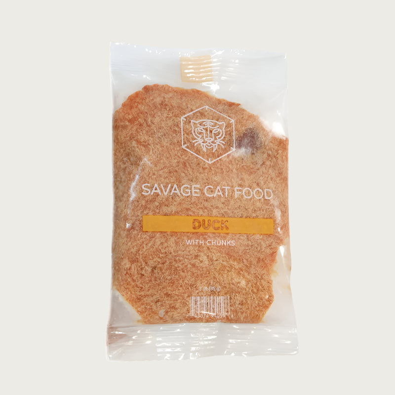 A 3 oz trial size pouch of Savage Cat Food, Duck recipe for cats. Pouch is clear plastic, with light reddish brown food inside.
