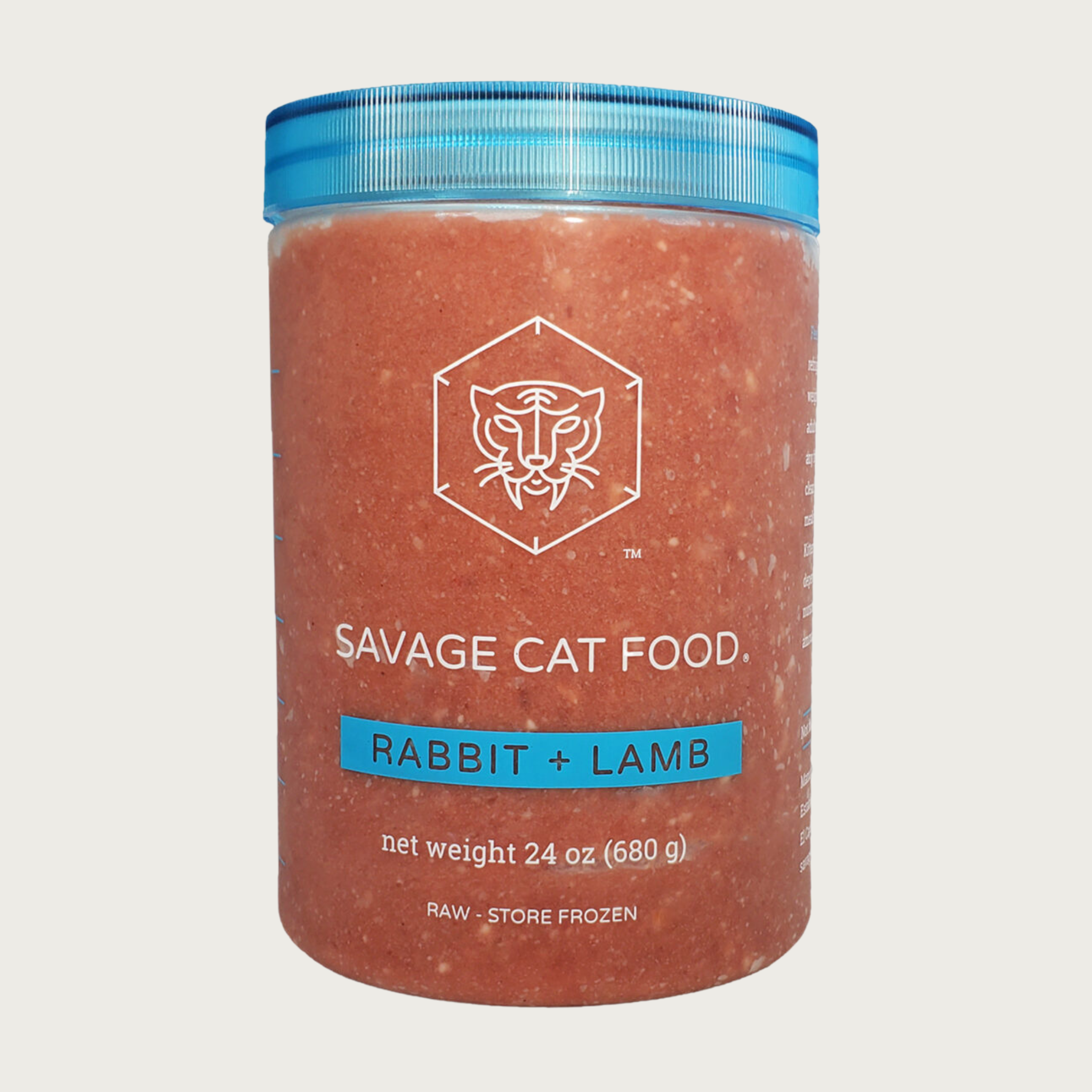 A 24 oz plastic tub of Savage Cat Food, Rabbit and Lamb recipe for cats. Tub is clear, with reddish food inside. Lid is blue. Raw. Keep Frozen.