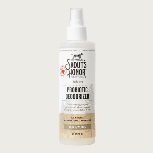 Opaque white spray bottle of Skout's Honor Probiotic Deodorizer in Dog of the Woods for daily-use. 97% natural with live topical probiotics. Designed to support your pet's natural defenses against itching, dryness, irritation & odor. 8 Fl Oz.