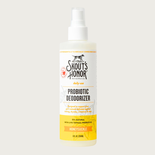 Opaque white spray bottle of Skout's Honor Probiotic Deodorizer in Honeysuckle for daily-use. 97% natural with live topical probiotics. Designed to support your pet's natural defenses against itching, dryness, irritation & odor. 8 Fl Oz.