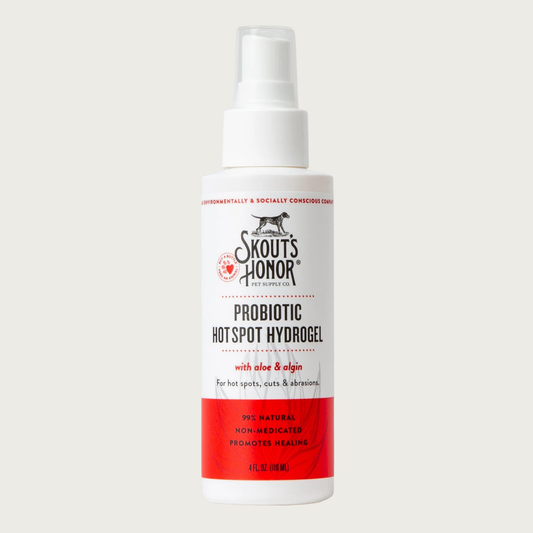 Opaque white spray bottle of Skout's Honor Probiotic Hot Spot Hydrogel with aloe & algin, for hot spots, cuts & abrasions. 99% natural, non-medicated, promotes healing. 4 Fl Oz.