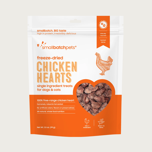An orange and white bag of Smallbatch freeze-dried raw chicken heart treats for dogs and cats, 3.5 ounces. This is a single ingredient treat. The bag has a small, clear window showing the whole organ treats, which are about 2-3 inches long.