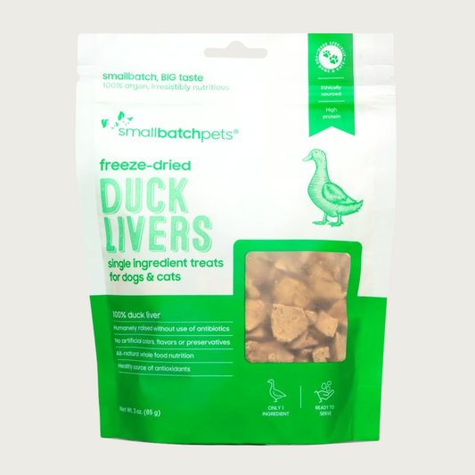 Bright green & white bag of smallbatch freeze-dried duck livers treats for dogs and cats. There is a small, transparent window showing product inside. They are small brown pieces.