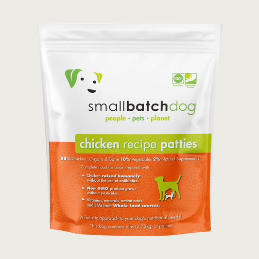 An orange and white bag of Smallbatch chicken batch recipe, frozen raw dog food. This 6 pound bag contains 12 patties.