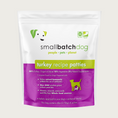 Load image into Gallery viewer, A purple and white bag of Smallbatch turkey batch recipe, frozen raw dog food. This 6 pound bag contains 12 patties.
