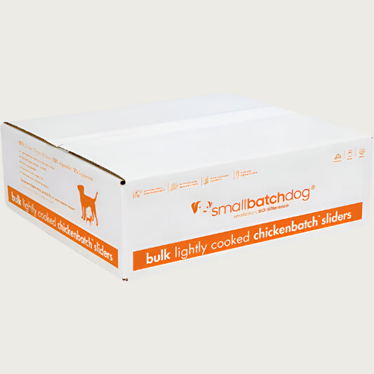 An orange and white, 10 pound bulk box of frozen Smallbatch chicken batch recipe sliders, lightly cooked dog food.
