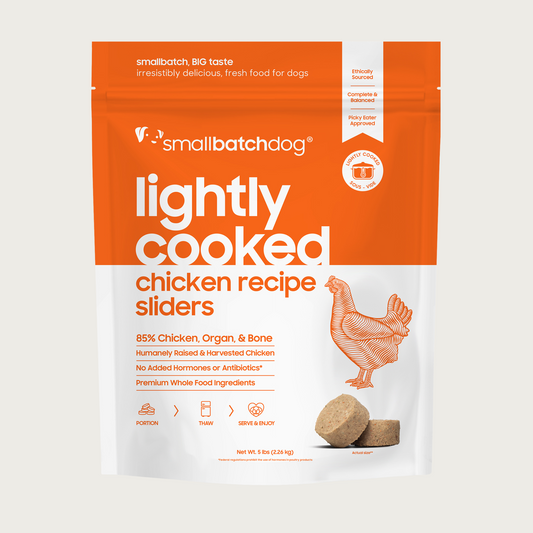 An orange and white, 5 pound bag of frozen Smallbatch chicken batch recipe sliders, lightly cooked dog food.