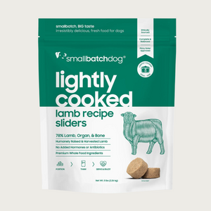 A dark green and white, 5 pound bag of frozen Smallbatch lamb batch recipe sliders, lightly cooked dog food.