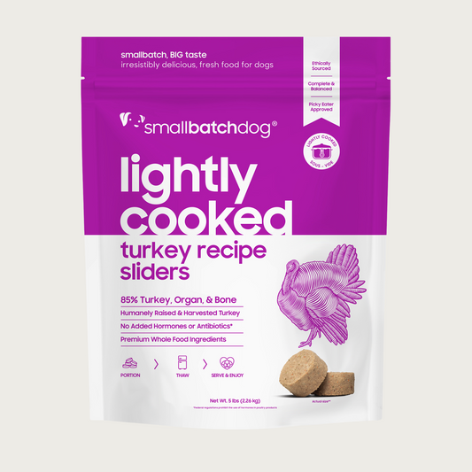 A purple and white, 5 pound bag of frozen Smallbatch turkey batch recipe sliders, lightly cooked dog food.
